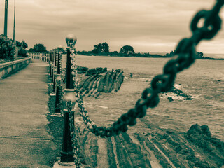 Canvas Print - Chain and bollard barrier in monochrome