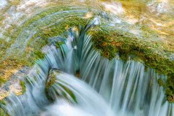 Poster - Converging edge of landform with water streaming over edge into pond below in Croatia