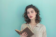 © grey - A beautiful woman holding a book