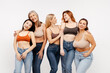 © Maria Vitkovska - Group of smiling beautiful women friends hugging, wearing sexy bras and jeans, fashion models