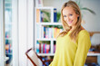 © ArcursJointTeam/peopleimages.com - Portrait, smile and woman in a home library for weekend reading, relax or stress relief in house. Book shelf, face and female person in study room for me time, novel or chilling on weekend or day off