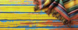 Mexican rug  a serape  for Cinco de Mayo holiday party celebration on bright yellow orange old 
  wooden background, top view, copy space. Fifth of May celebration concept.