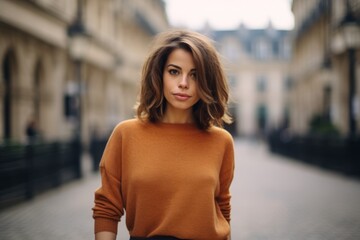 Wall Mural - Outdoor portrait of beautiful young woman in the streets of Paris.