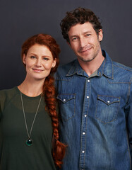 Poster - Couple, smile in portrait and calm together in studio, trust and loyalty in relationship with care isolated on grey background. People with peace, marriage or partner for support, solidarity and love