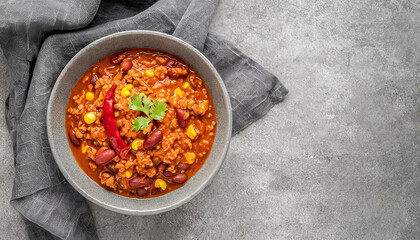 Canvas Print - beef chili. top view of homemade beef chili con carne on grey bowl, copy space