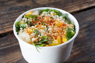 Wall Mural - A closeup view of a cup of esquites.