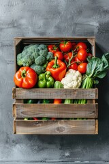 Wall Mural - A wooden crate filled with a variety of fresh vegetables. Perfect for food and agriculture concepts
