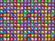 Seamless multicolored texture of oval colored stones as a backgr