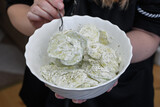 Fototapeta  - Świeże ogórki w śmietanie z cebulką i koperekiem w białej misce