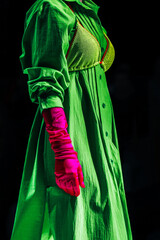 Sticker - Interesting creative bright outfit green dress, pink gloves on black background