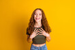 Photo of glad positive lovely good mood girl wear trendy clothes two arms touch chest isolated on vivid yellow color background