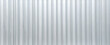 Metal aluminum silver corrugated stripe sheet wall background with texture vertical lines