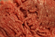 Close-up of minced beef meat in a white plastic box. Uncooked raw red mincemeat portion