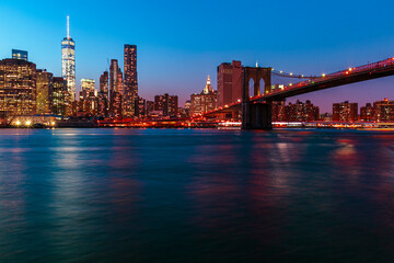 Wall Mural -  Brooklyn Bridge with lower Manhattan skyline in New York City at night, USA. Long exposure at night