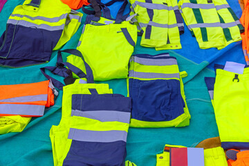 Wall Mural - Bunch of New High Visibility Work Pants Safety Gear Clothing