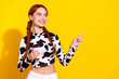Photo of sweet dreamy lady dressed cowskin print top enjoying milk showing finger empty space isolated yellow color background