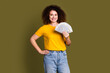 Photo of successful woman young age millionaire wear yellow t shirt earn money for dream purchase isolated on khaki color background