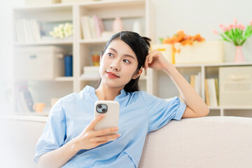 Wall Mural - Photo of young Asian girl at home