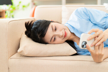 Wall Mural - Photo of young Asian girl at home