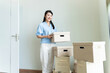 Young Asian woman moving to new house
