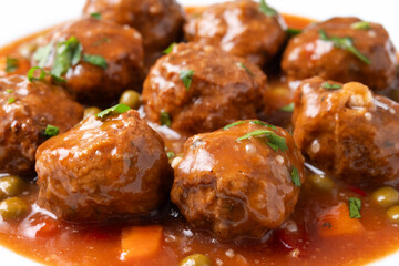Sticker - Meatballs, green peas and carrot with tomato sauce. Close up