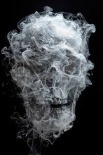 Human Skull Surrounded And Covered In Grey Smoke On Black Background.