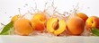 Peaches falling into a white bowl filled with water as they create splashes