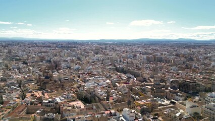 Wall Mural - Panoramic aerial view of Valencia, Spain. Drone forward above the city center. Panoramic view of all city. Famous travel destination visited annually by many foreign tourists. Rooftop of Valencia