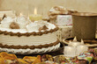 Cake with tea on a background of candles. Dessert in the form of a cake in a festive setting. Poster for interior.