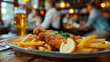 Schnitzel with fries and a glass of beer on a table.