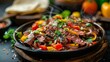 A sizzling steak fajita platter with tender strips of grilled steak sauted peppers and onions warm tortillas shredded cheese and an assortment of fresh salsas and guacamole