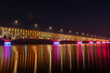 Bridge of the Legions of Josef Pilsudski at night with colorful lighting. Plock, Poland