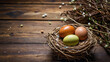 Easter eggs in a nest on a wooden table with copy space