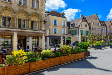 Wall Mural - Old street with old houses and tables of cafe in a small town Chartres, France