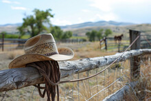American West Rodeo, Cowboy Hat And Lasso On A Fence