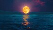 Full moon over the sea at night with reflection on the water surface. Beautiful natural background concept of a super full cresent moon in yellow, orange and purple colors in the sky