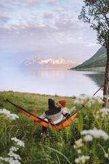 Wall Mural - couple in love chilling in hammock man and woman traveling together summer vacations friends on camp