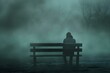 A person sitting alone on a bench looking downcast surrounded by empty space and a desolate atmosphere. Concept Loneliness, Sadness, Emptiness, Solitude, Desolation