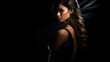 Sexy strict woman with black dress, tan skin, makeup and a fashionable hairstyle poses in studio on black background, with copyspace, blank space for text. Black friday shopping design concept