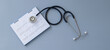stethoscope with date on the calendar page on a gray background Health care concept.	