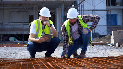 team of construction workers senior architect or civil engineer and foreman discussion to inspection