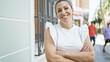 © Krakenimages.com - Young blonde woman smiling confident standing with arms crossed gesture at street