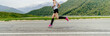 female athlete in black compression socks running road in background mountains and forests