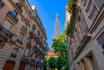 Wall Mural - view of eiffel tower and cozy street in paris, france. eiffel tower is one of the most iconic landma
