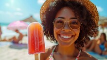 Beautiful Young Girl In Straw Hat Holds Cold Orange Ice Cream On The Beach On Hot Day. Summer Holidays. Delicious Cooling Dessert. Happy Smiling Latino Woman Eating Icecream Outdoor. Curley Hair.