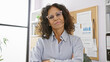 © Krakenimages.com - Confident middle-aged hispanic woman in office with glasses, professional, business, corporate, executive