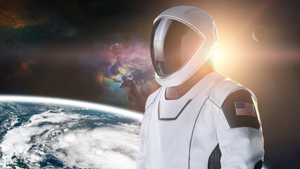 Wall Mural - spaceman in outer space on earth planet background. exploration theme. elements of this image furnis