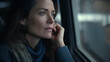 portrait of a mature woman in a train, looking at the window