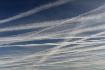 Amsterdam The Netherlands Aircraft con trails over the city.