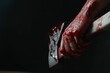 Man holding bloody axe on black background, closeup. Space for text